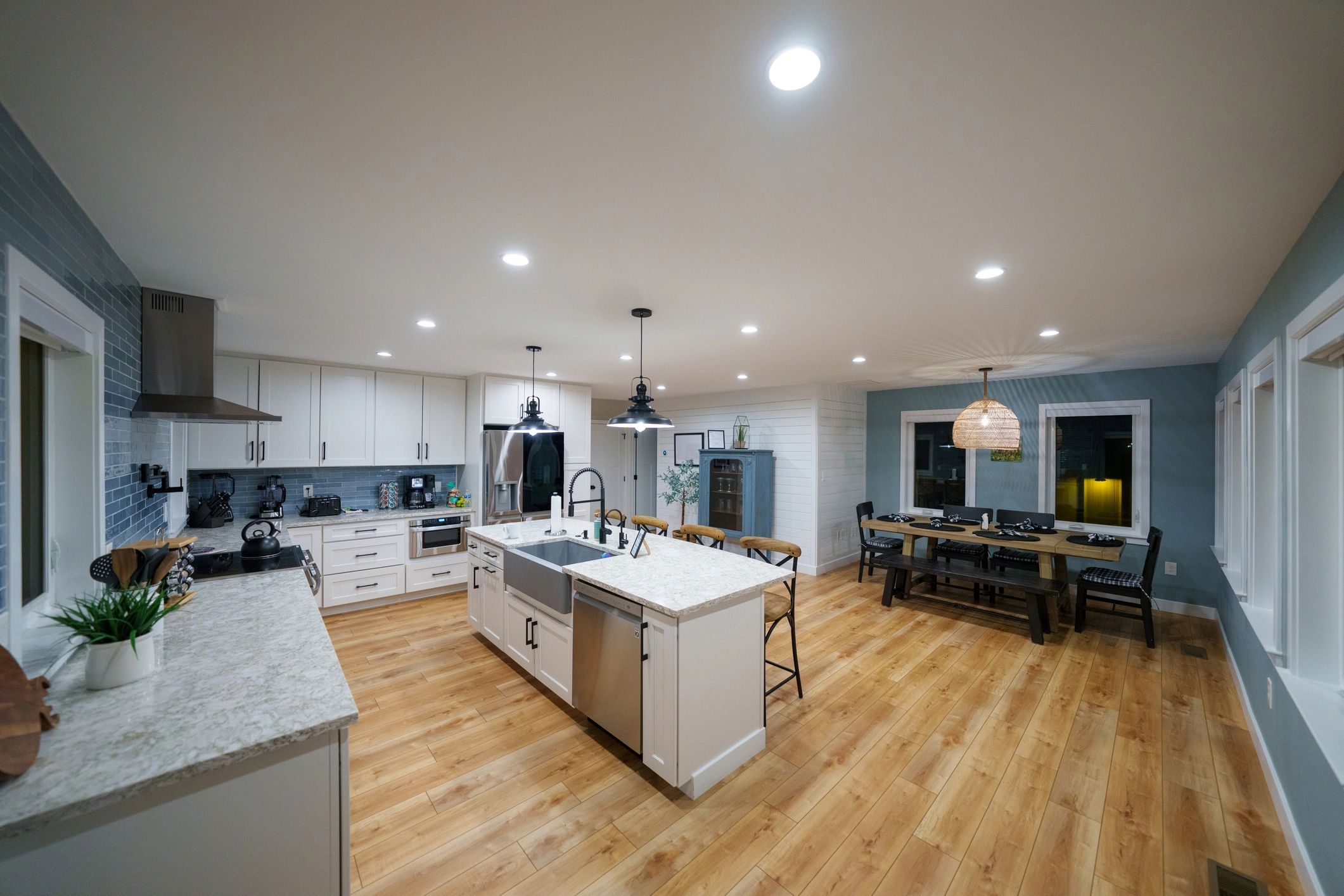 Bright kitchen showcasing finished stone countertops